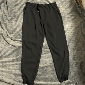 Black athletic joggers tie waist with cinched ankle with pocket